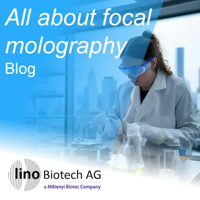 Blog cover for the article on focal molography: a researcher in a lab coat and safety goggles working in a laboratory